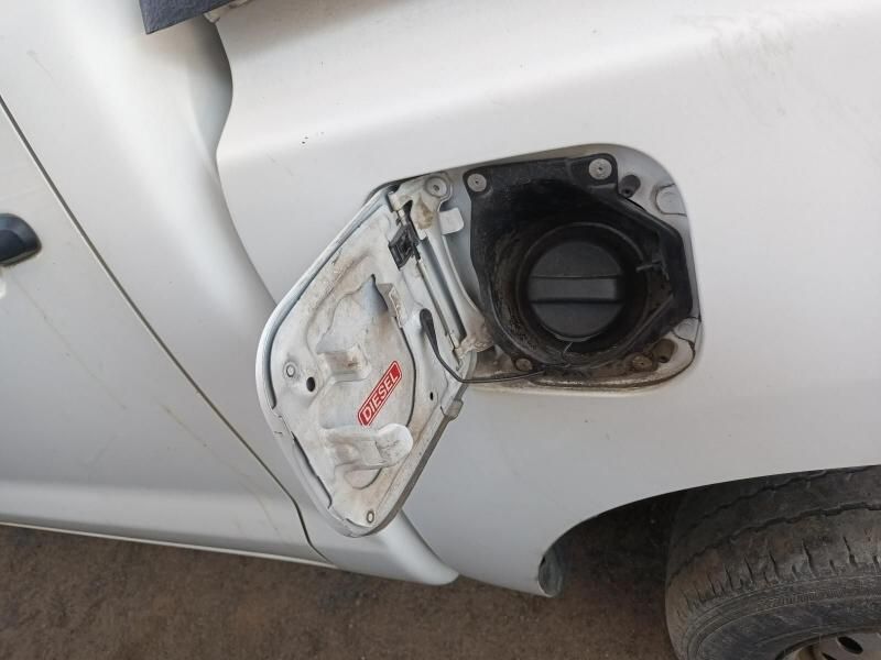 A Close Up of a White Car With the Fuel Tank Open — South West 4WD Wreckers In Harristown, QLD