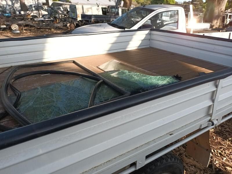 A White Truck With a Broken Window in the Back of It — South West 4WD Wreckers In Brisbane, QLD