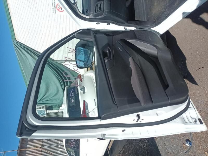 A White Car With the Door Open is Parked on the Side of the Road — South West 4WD Wreckers In Harristown, QLD