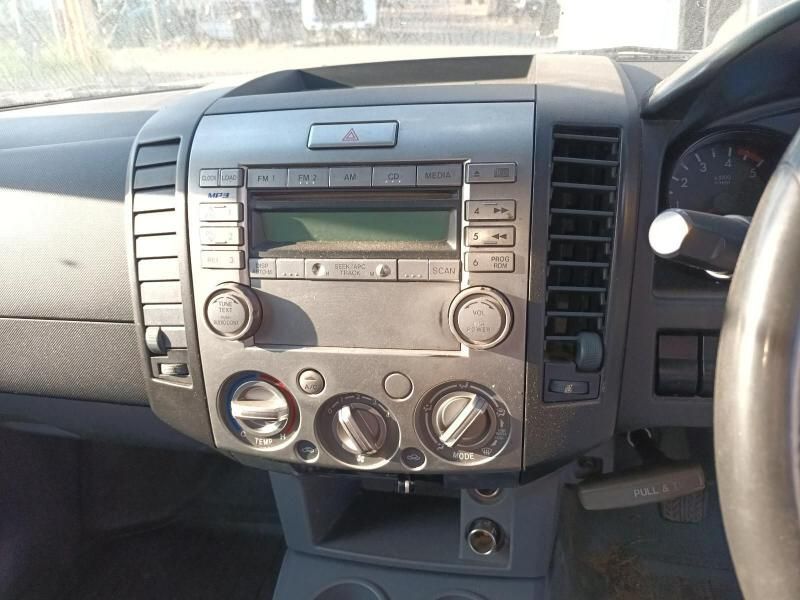 A Car Dashboard With a Radio and a Steering Wheel — South West 4WD Wreckers In Harristown, QLD
