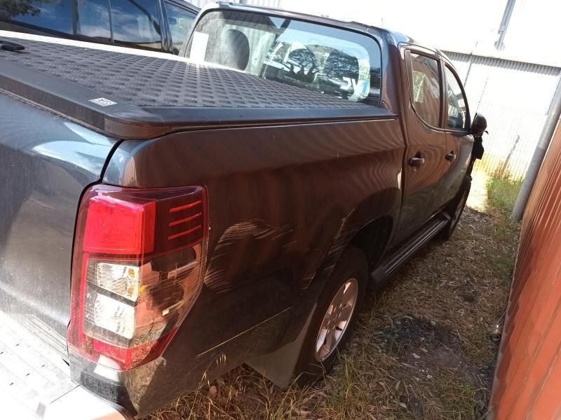 A Brown Pickup Truck is Parked in Front of a Building — South West 4WD Wreckers In Harristown, QLD