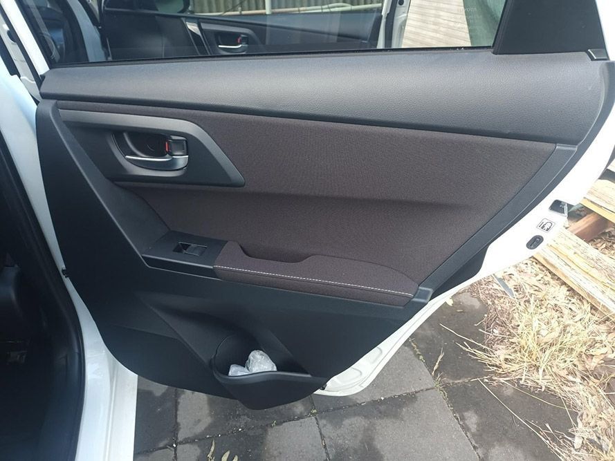 The Back Door of a White Car with the Door Open — South West 4WD Wreckers in Harristown, QLD