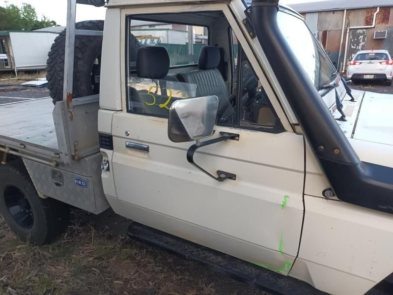 A White Truck With a Tire on the Back of It — South West 4WD Wreckers In Brisbane, QLD