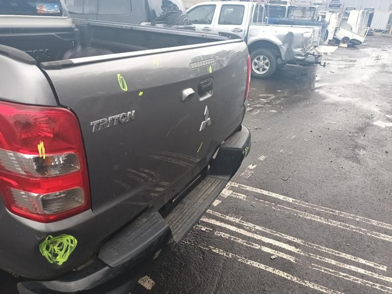 A Mitsubishi Triton Pickup Truck is Parked in a Parking Lot — South West 4WD Wreckers In Brisbane, QLD