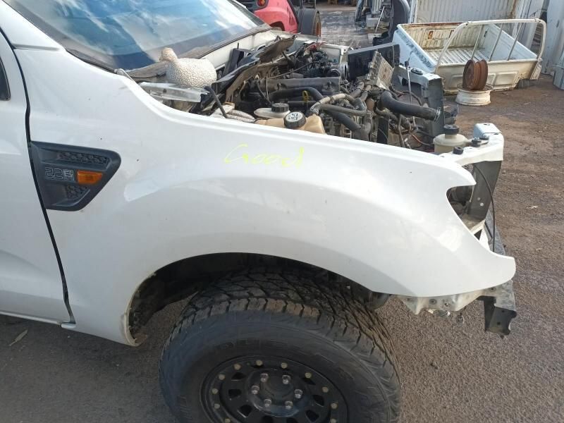 A White Truck With the Hood Open is Parked on the Side of the Road — South West 4WD Wreckers In Brisbane, QLD