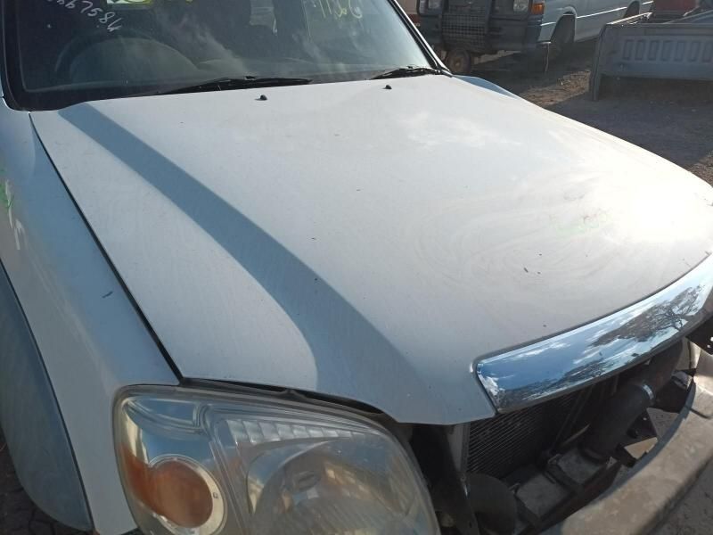 A White Car With the Hood Up is Parked in a Parking Lot — South West 4WD Wreckers In Harristown, QLD