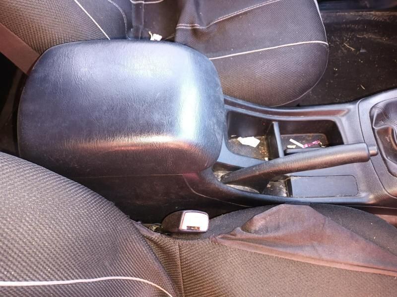 A Car With a Black Arm Rest and a Black Seat Cover — South West 4WD Wreckers In Harristown, QLD