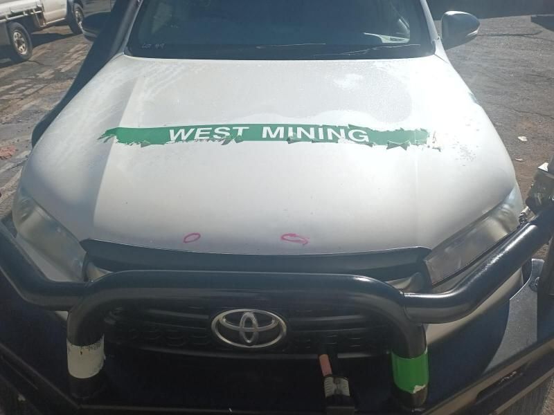 A White Truck With a Green Sticker on the Hood That Says West Mining — South West 4WD Wreckers In Brisbane, QLD