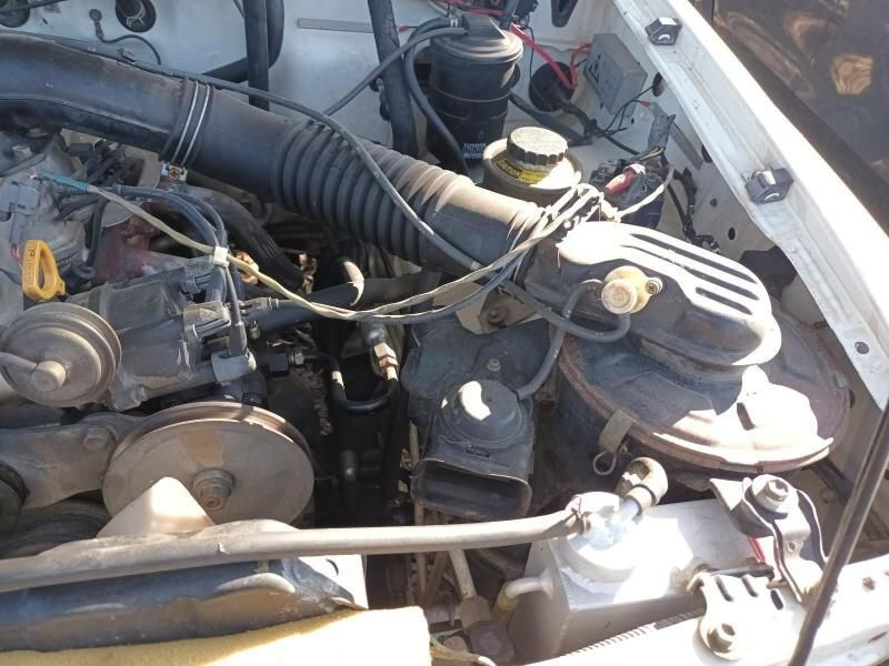 A Close Up of the Engine of a White Car — South West 4WD Wreckers In Brisbane, QLD