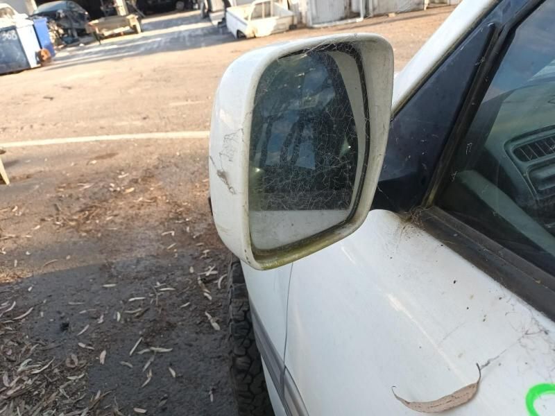 A White Car Has a Broken Side Mirror on It — South West 4WD Wreckers In Harristown, QLD