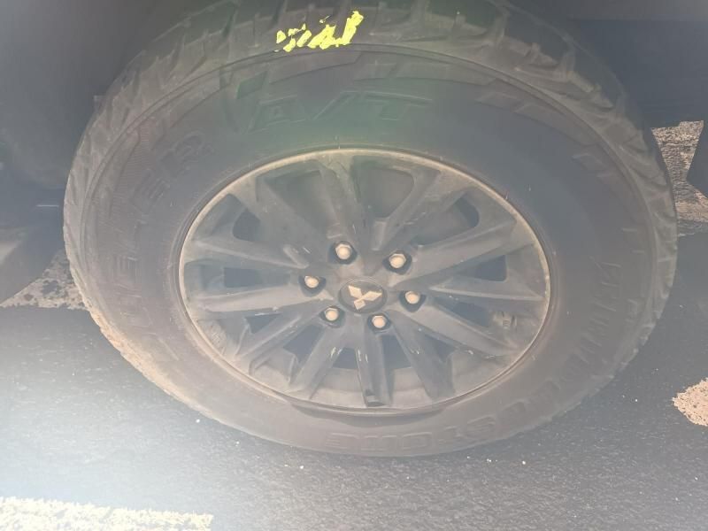 A Close Up of a Tire on a Car in a Parking Lot — South West 4WD Wreckers In Brisbane, QLD