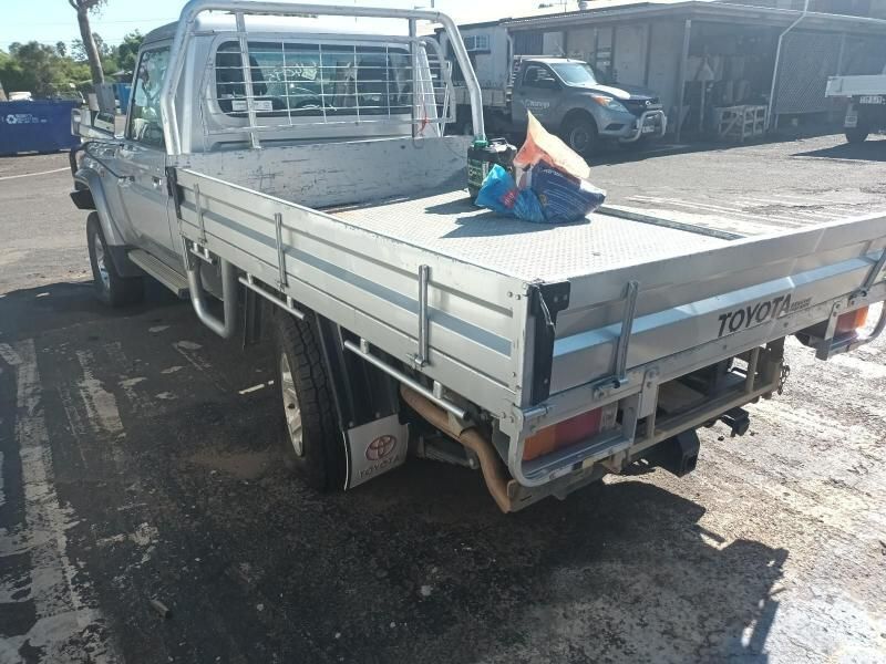 A Silver Toyota Truck is Parked in a Parking Lot — South West 4WD Wreckers In Harristown, QLD