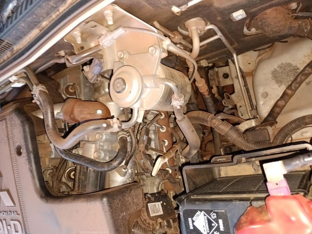 A Person is Working on the Engine of a Car — South West 4WD Wreckers In Brisbane, QLD