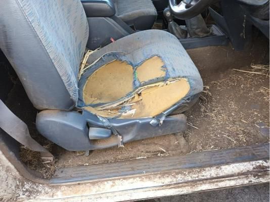 A Car Seat With a Hole in It is Sitting in a Dirty Car — South West 4WD Wreckers In Brisbane, QLD
