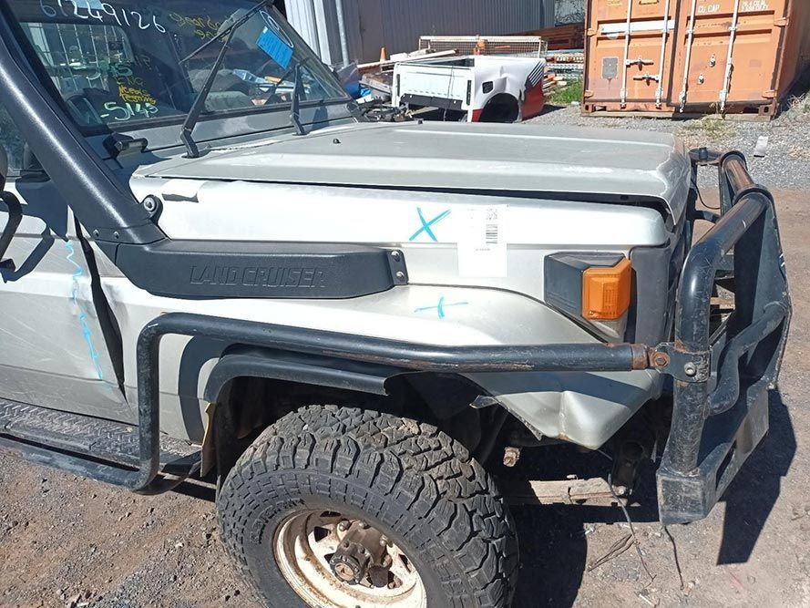 A Toyota Land Cruiser with a Snorkel on the Hood is Parked in a Parking Lot — South West 4WD Wreckers in Harristown, QLD