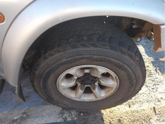 A Close Up of a Tire on a Silver Car — South West 4WD Wreckers In Brisbane, QLD