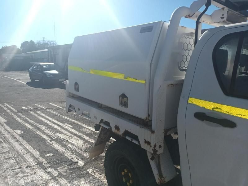 A White Truck is Parked on the Side of the Road — South West 4WD Wreckers In Brisbane, QLD