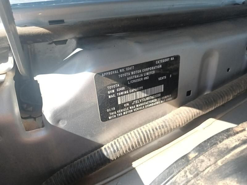 A Silver Car With a License Plate That Says Toyota — South West 4WD Wreckers In Harristown, QLD