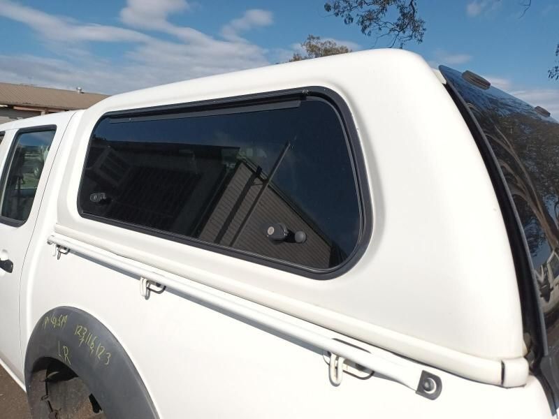 A White Truck With a Canopy on Top of It — South West 4WD Wreckers In Harristown, QLD