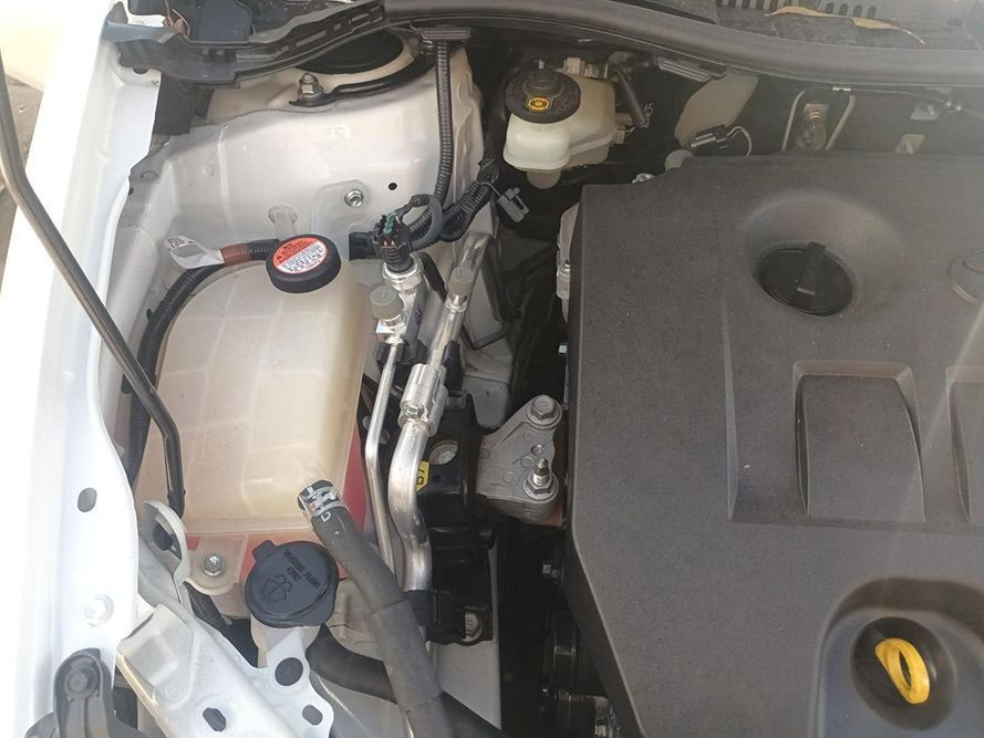 A Close Up of the Engine of a White Car — South West 4WD Wreckers in Harristown, QLD