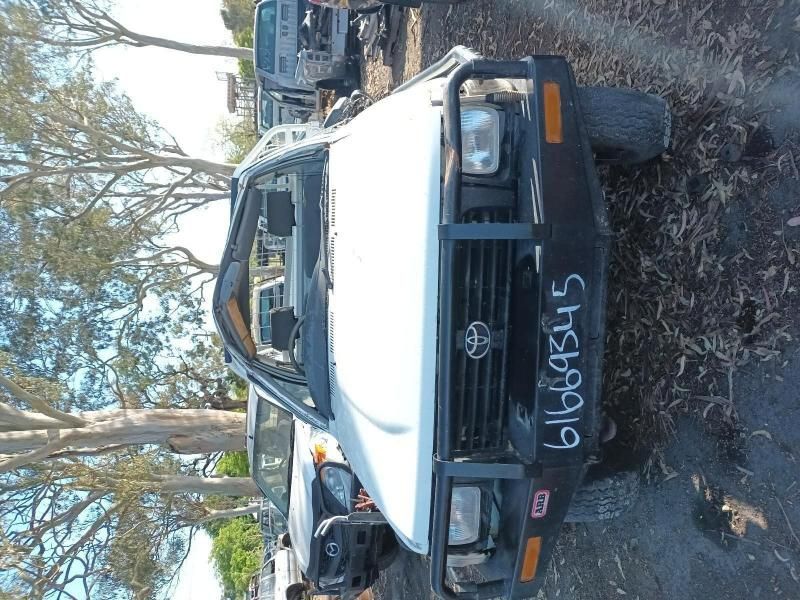 A White Truck With a License Plate That Says 6l666345 — South West 4WD Wreckers In Brisbane, QLD