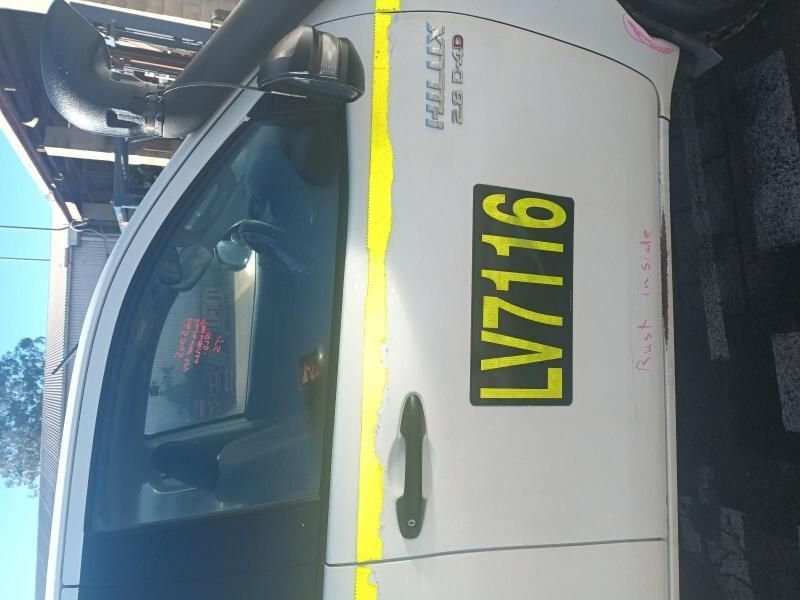 A White Car With a License Plate That Says Lv7116 — South West 4WD Wreckers In Brisbane, QLD