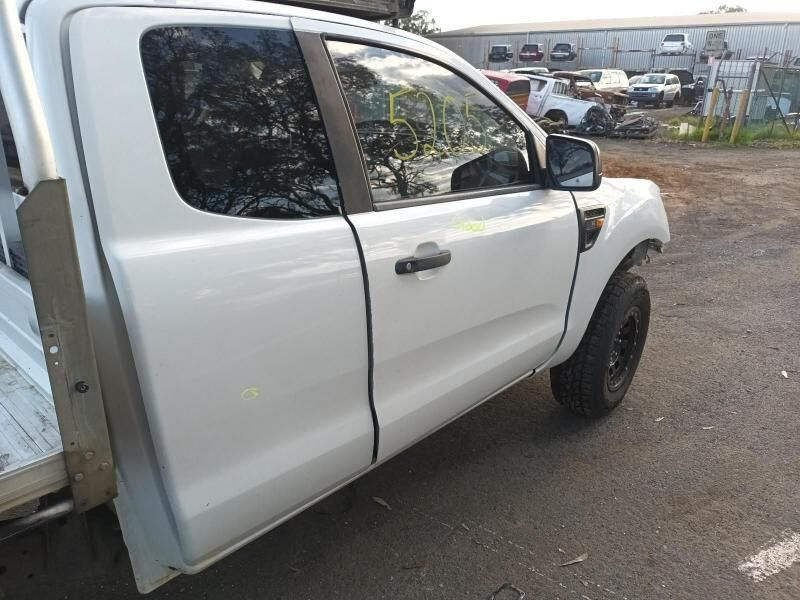 A White Truck With the Door Open is Parked in a Parking Lot — South West 4WD Wreckers In Brisbane, QLD
