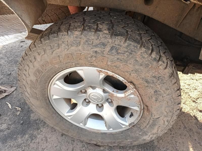 A Close Up of a Tire on a Car on a Dirt Road — South West 4WD Wreckers In Harristown, QLD
