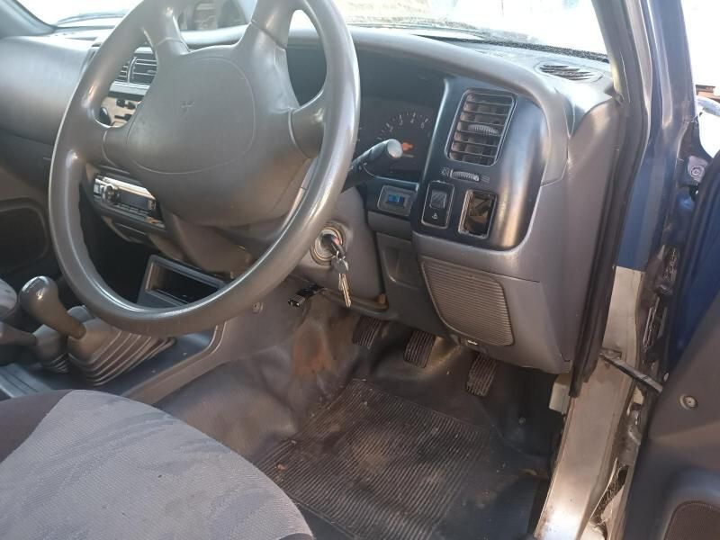 The Inside of a Blue Car With a Steering Wheel — South West 4WD Wreckers In Brisbane, QLD
