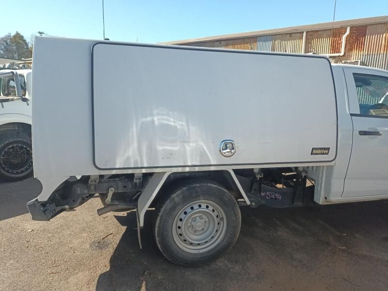 A White Truck With a Canopy is Parked in a Parking Lot — South West 4WD Wreckers In Harristown, QLD