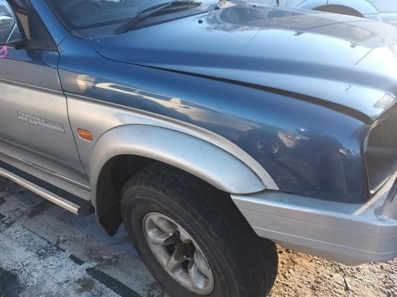 A Blue and Silver Truck is Parked in a Parking Lot — South West 4WD Wreckers In Brisbane, QLD