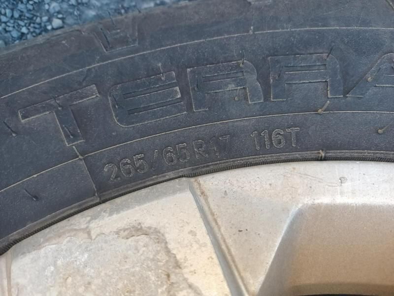 A Close Up of a Tire With the Numbers 265 65r17 116t on It — South West 4WD Wreckers In Harristown, QLD