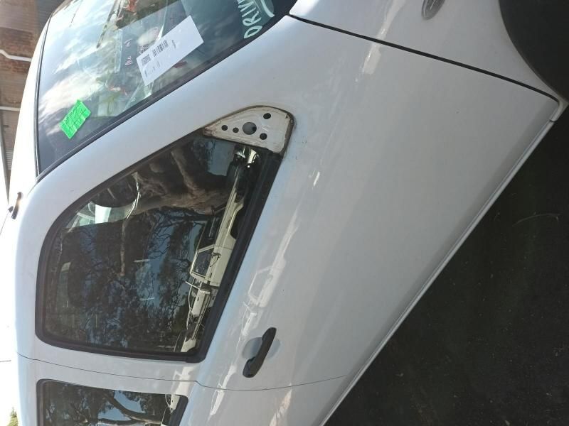 A White Car With a Green Sticker on the Windshield — South West 4WD Wreckers In Harristown, QLD