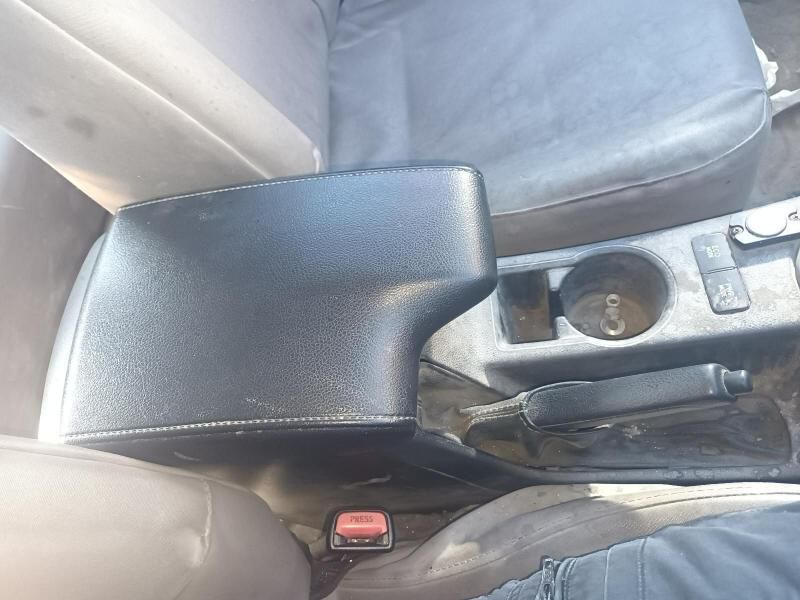 A Black Arm Rest in a Car With a Cup Holder — South West 4WD Wreckers In Brisbane, QLD
