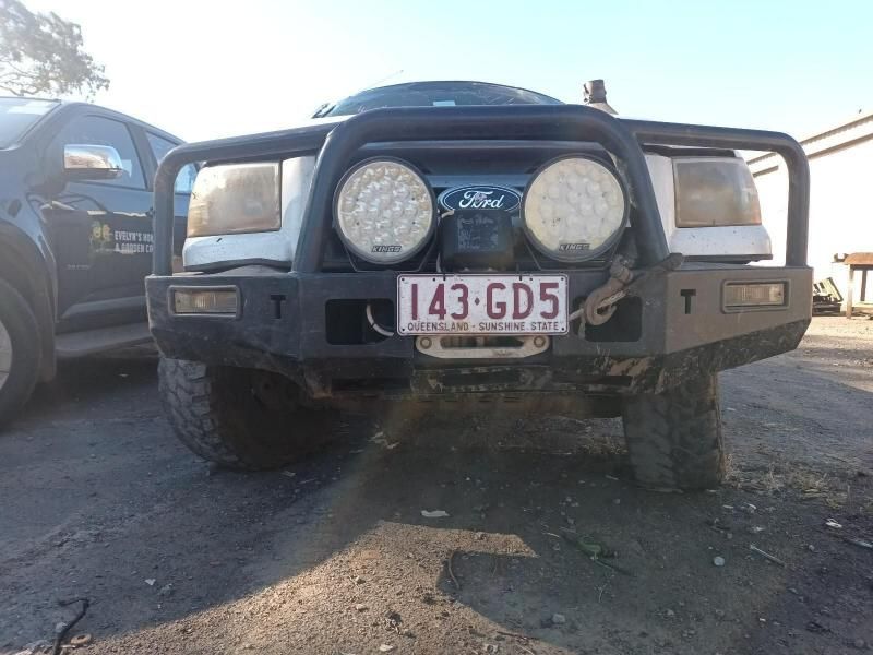 A Black Truck With a License Plate That Says 143 Gd5 — South West 4WD Wreckers In Harristown, QLD