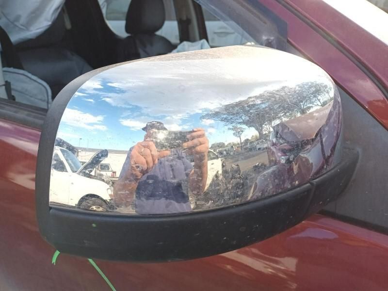 A Man is Taking a Picture of Himself in the Side Mirror of a Car — South West 4WD Wreckers In Harristown, QLD