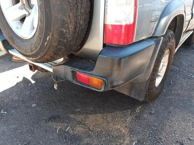 A Car With a Spare Tire is Parked on the Side of the Road — South West 4WD Wreckers In Harristown, QLD