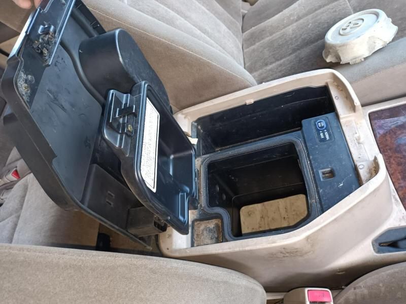 A Car Console With the Lid Open and a Wiper in the Background — South West 4WD Wreckers In Harristown, QLD