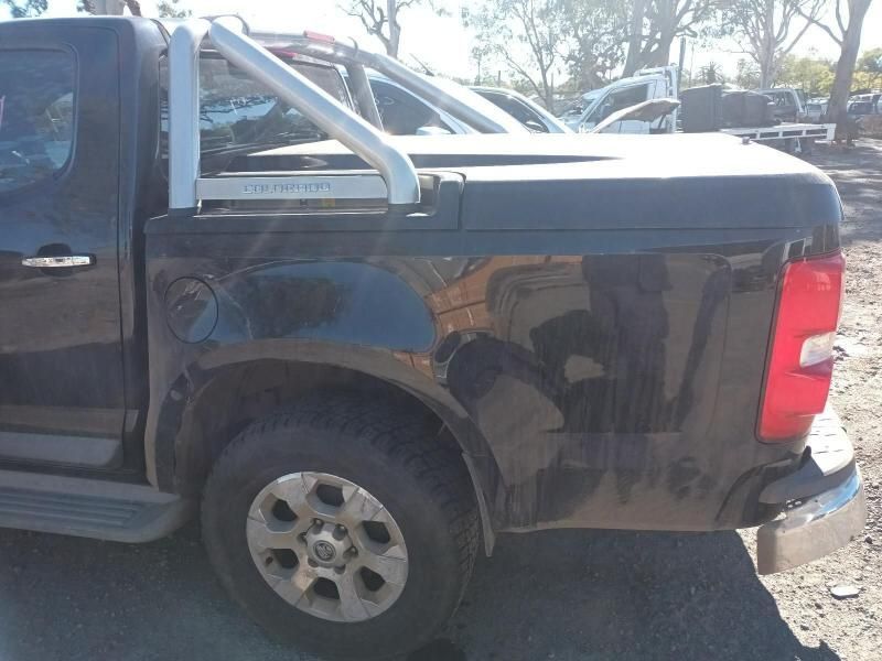 A Black Truck is Parked on the Side of the Road — South West 4WD Wreckers In Harristown, QLD