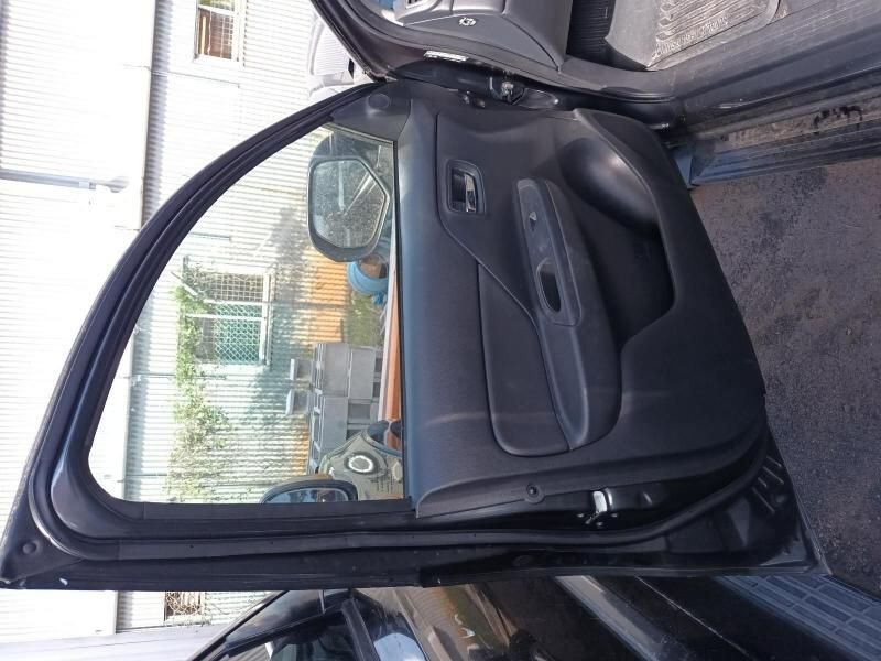 A Black Car With the Door Open and the Window Open — South West 4WD Wreckers In Harristown, QLD