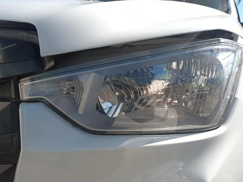 A Close Up of a Car Headlight With a Damaged Hood — South West 4WD Wreckers In Harristown, QLD