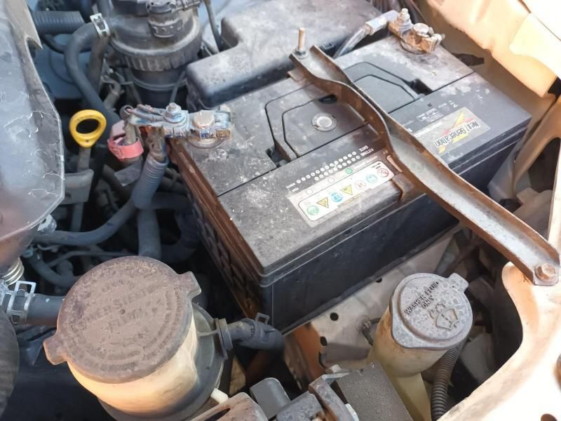 Two Batteries Are Sitting Under the Hood of a Car — South West 4WD Wreckers In Harristown, QLD
