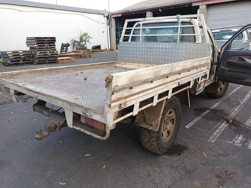 A Truck With a Flat Bed is Parked in a Parking Lot — South West 4WD Wreckers In Brisbane, QLD