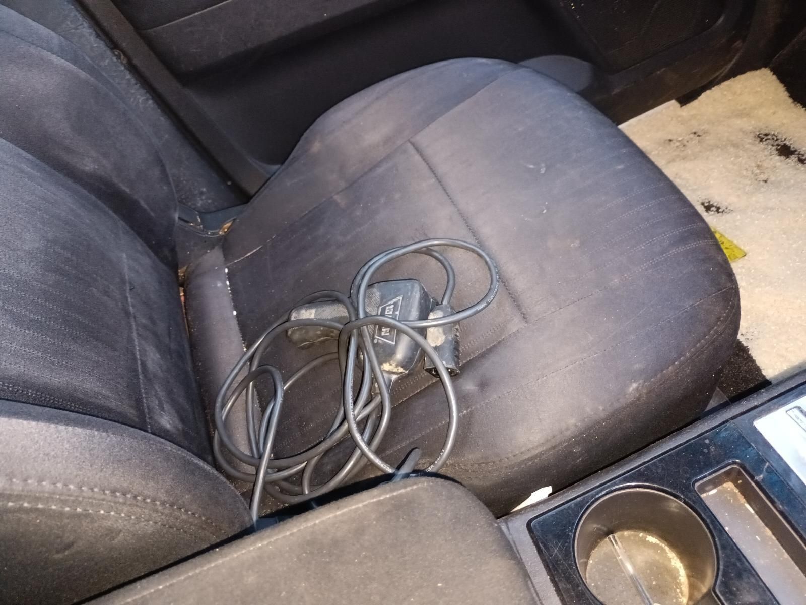 A Car Seat With a Charger Plugged Into It — South West 4WD Wreckers In Brisbane, QLD