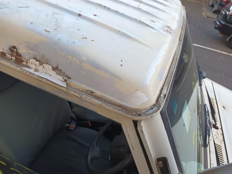 A White Truck With a Broken Windshield is Parked on the Side of the Road — South West 4WD Wreckers In Brisbane, QLD