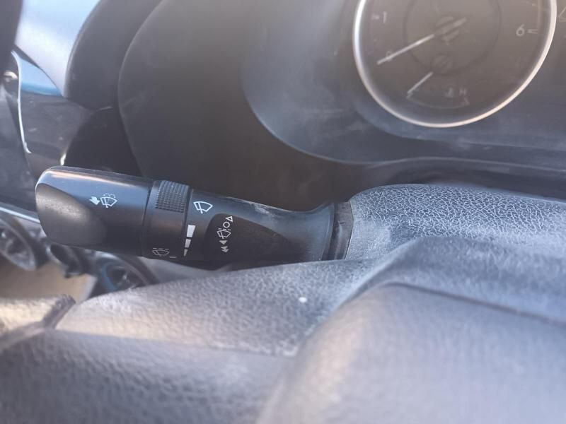 A Close Up of a Car Dashboard With a Wiper Switch and a Clock — South West 4WD Wreckers In Brisbane, QLD