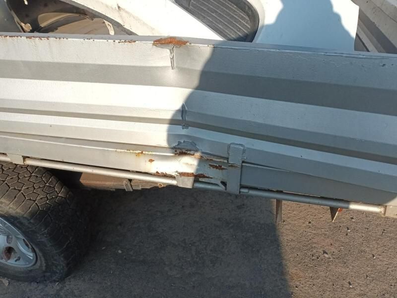 A Car With a Damaged Side is Parked on the Side of the Road — South West 4WD Wreckers In Harristown, QLD