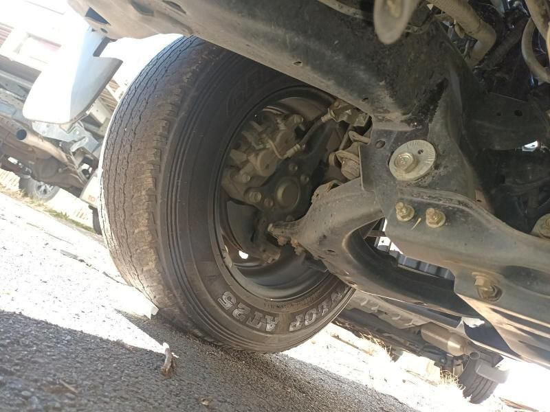 A Close Up of the Underside of a Car With a Tire on the Ground — South West 4WD Wreckers In Harristown, QLD
