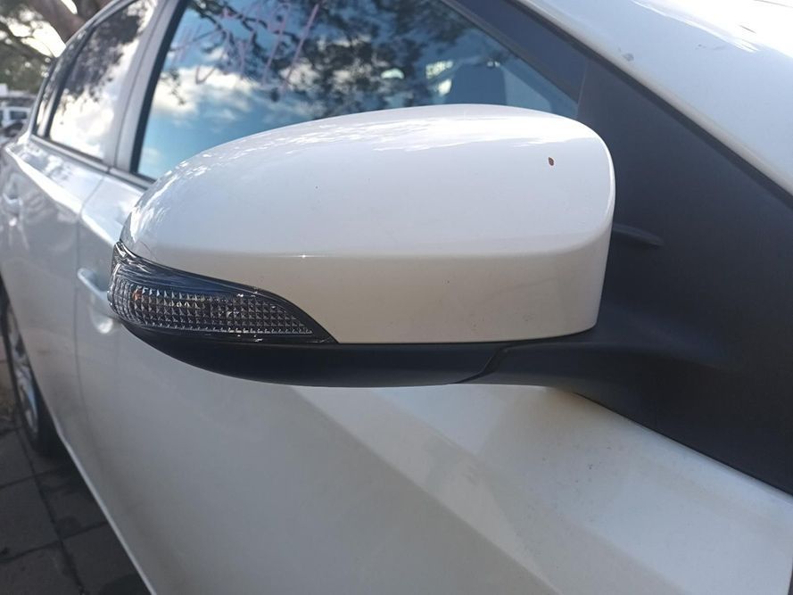 A Close Up of a Side View Mirror on a White Car — South West 4WD Wreckers in Harristown, QLD