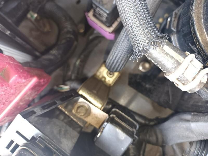 A Close Up of a Car Engine With a Hose Attached to It — South West 4WD Wreckers In Brisbane, QLD